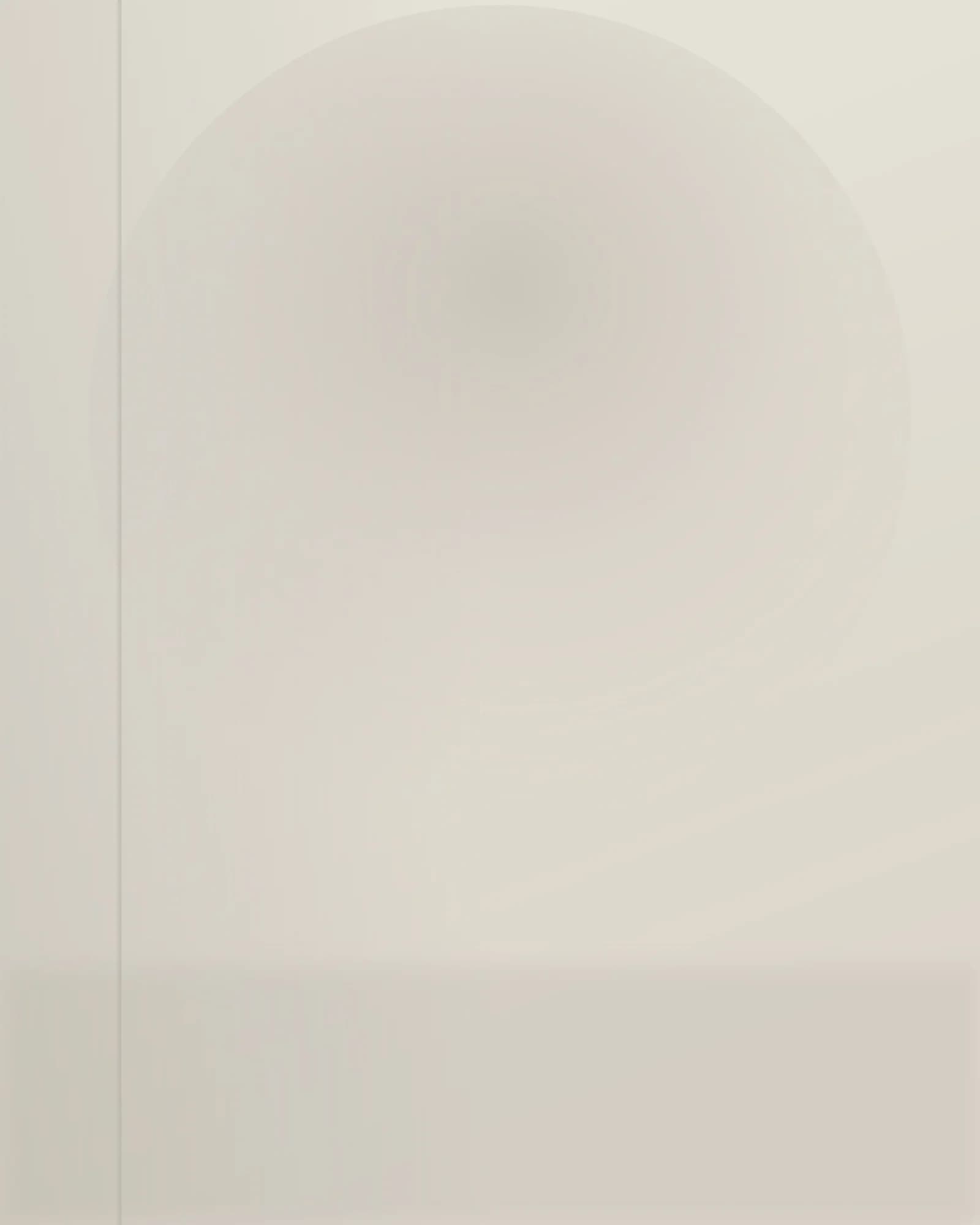 Monolith low table — solid stone volume in daylight